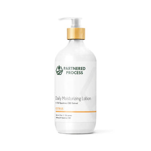 White pump bottle of Partnered Process daily moisturizing CBD citrus lotion with bamboo top, 8 oz.