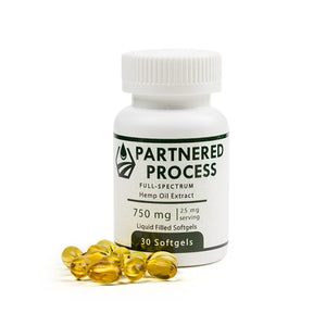 Partnered Process 750mg full-spectrum hemp oil softgels bottle with golden liquid-filled capsules displayed beside it.