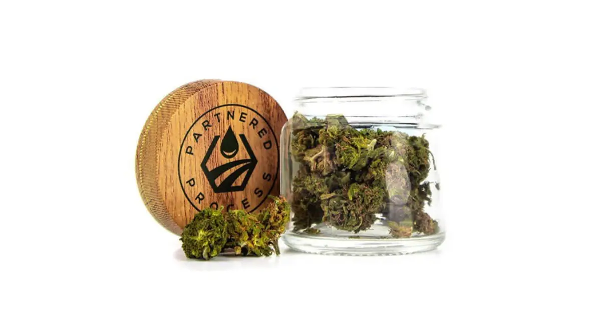 CBG cannabinoid hemp flower in glass jar labeled Partnered Process for natural relief.