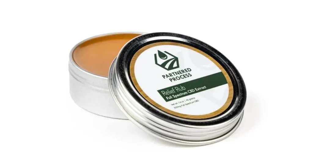 Best CBD salve for athletes shown in a tin labeled Relief Rub with full spectrum CBD extract.
